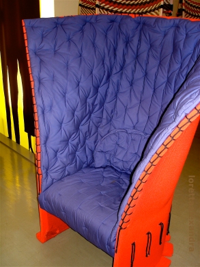 High-back quilted fabric upholstered armchair